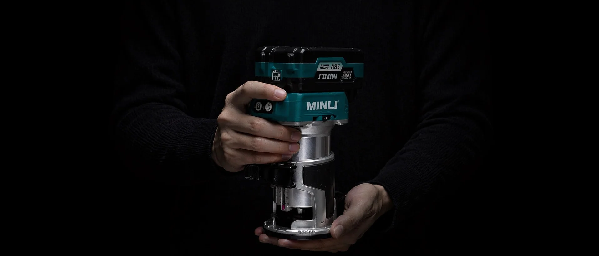 Holding a MINLI DC901 Cordless Trim Router in a workshop